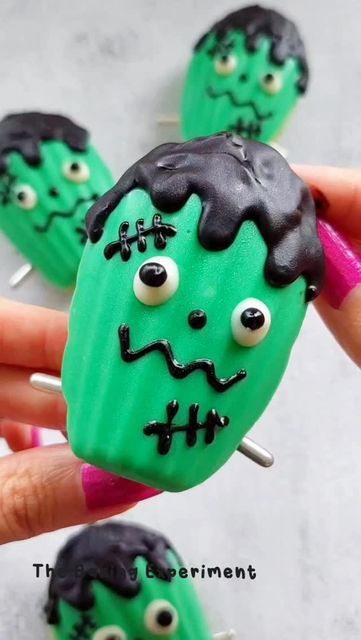 Jean Yap on Instagram: "Frankenstein madeleines ~ these were infused with pandan and were so fragrant!   #madeleines #cutehalloween #cutefood #cutedessert #halloweendesserts #halloweenbaking #buzzfeedtasty #chocolatecoveredtreats" Halloween Madeleine, Frankenstein Guacamole, Frankenstein Treats Halloween, Frankenstein Macarons, Frankinstine Rice Crispy Treats, Frankenstein Cookie, Halloween Monster Mash Cookies, Madeline Cookies, Buzzfeed Tasty