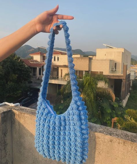 Add a touch of handmade charm to your wardrobe. Explore our crochet bags, crafted with love and style. 💙 #SupportSmallBusiness #CrochetAccessories” Crochet Bubble Bag, Blue Crochet, Bubble Bag, Bag Crochet, Handmade Charms, Crochet Bags, Support Small Business, Crochet Accessories, Crochet Bag