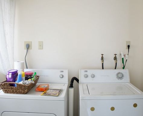 hide cords and hoses in the laundry room with this easy DIY Cover Hoses In Laundry Room, How To Hide Hoses In Laundry Room, How To Hide Washing Machine Hoses, Laundry Hose Cover, Hiding Laundry Room Hookups, Hidden Laundry Rooms, Basement Laundry Room Makeover, Stackable Laundry, Dryer Hose