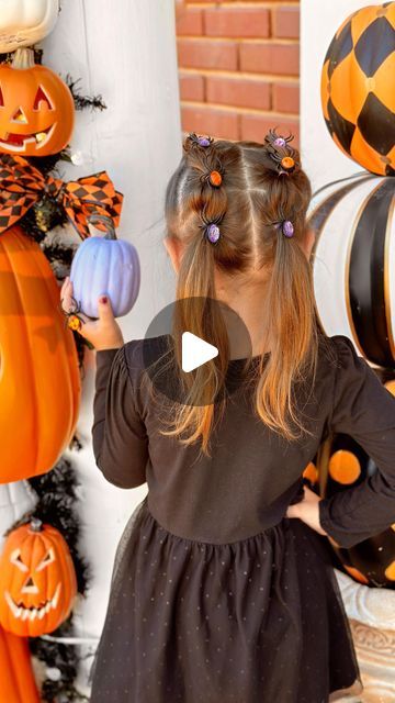 Lauren Vandiver Green on Instagram: "Spooky Spider Halloween Girls’ Hairstyle.🕷️✨ We used the cutest $1.25 plastic jewel spider rings from Dollar Tree for this easy spider bubble braid hairstyle, but you can use any plastic Halloween rings.💜🧡 It’s a simple no-braid braid that anyone can do. All you need are small rubber bands, plastic spider or Halloween rings, a comb to part hair and a clip to separate hair.🕸️ Step by step instructions below for this easy Halloween hair tutorial.

🕷️SPOOKY SPIDER BUBBLE BRAID STEPS:🕷️

1. Part hair down the middle. Secure one side with a clip.
2. Part a 2 inch section of hair at the top of one side and secure with rubber band.
3. Separate another 2 inch section below, add to top section and secure with rubber band.
4. Repeat until all hair in first Spider Ring Hair, Spider Hair Bun, Spider Hairstyle, Kids Halloween Hair, Easy Halloween Hair, Spooky Hairstyles, Halloween Hairstyles For Kids, Bubble Braid Hairstyle, Halloween Rings