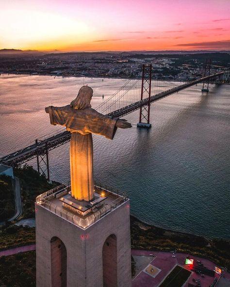 Sanctuary Of Christ The King With View Of The Ponte 25 De Abril In Lisbon, Portugal Summer Abroad, City Tree, Angkor Wat Temple, Breathtaking Photography, Two Guys, Christ The King, Visit Portugal, Two Friends, How To Earn Money