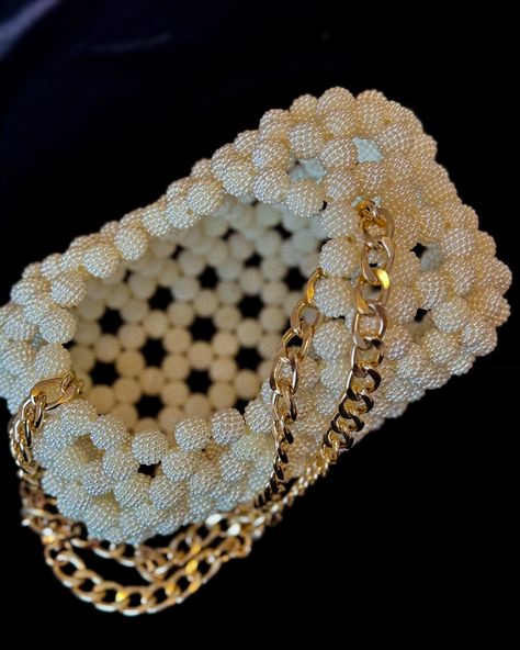 This elegant heart-shaped bag is beautifully crafted with intricate beading, creating a luxurious and eye-catching texture. The soft ivory beads form a unique, open pattern, complemented by a chic gold chain strap, making it a perfect accessory for special occasions or adding a touch of glamour to any outfit. . . . . #handmade #beadedbag #heartshape #heartbag #purse #giftideas #giftforher #etsy #supportsmallbusiness #beadedpurse #uniquedesign #uniquebag #bridalgift #weddingbag #bridalpurse Heart Shape Bag, Heart Shaped Bag, Intricate Beading, Bridal Purse, Heart Bag, Wedding Bag, Unique Bags, Bridal Gifts, Heart Shape