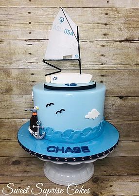 Boat Cake Sail boat McLaughlin sailboat Topper Sea cake #sweetsuprisecakes #sailboat #sailingcake Sail Cloth Benjamin Moore, Optimist Sailboat, Sailing Boat Cake, High School Graduation Cupcakes, Sailing Cake, Graduation Cupcake Cake, Graduation Cupcake Stand, Sailboat Cake, Sailing Tattoo