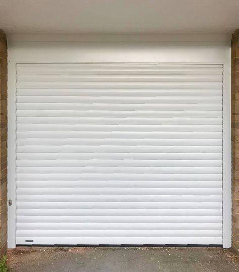 A Seceuroglide Classic Roller Garage Door in White, fitted between the opening with a manual override in the event of a power failure. It was installed in Epsom by our New Malden Branch.  If you're pressed for space within your garage, we recommend a SeceuroGlide Roller Garage Door. They can be fitted either between, behind or in front of the opening & come with the 'Secured By Design' certification for your peace of mind.  Call us on 0800 716 569 or visit www.accessgaragedoors.com Glass Kitchen Cabinet Doors, Security Shutters, Shutter Designs, Rolling Shutter, Metal Doors, Roll Up Doors, Power Failure, Metal Door, Editing Background