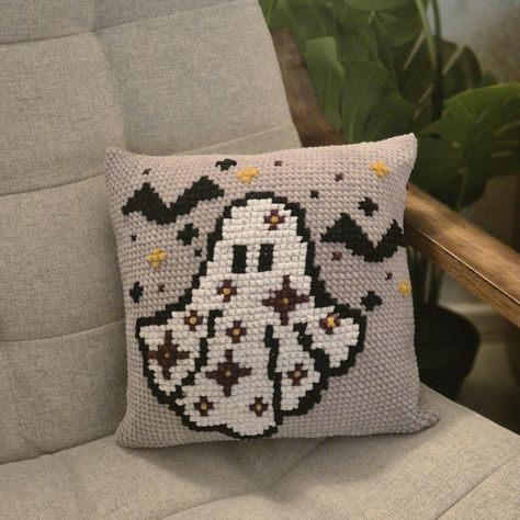 This halloween ghost cushion cover pattern, is adorable and beginner friendly.  This pattern blends crochet and cross stitch, two things I love and makes a super cute pillow pattern.  The base pattern of the cushion cover is made up of single crochets made in the round to form the cover.  the design is made up of cross stitch, if you are unfamiliar with cross stitch there are plenty of pictures and explanations in this pattern.  Once purchased, this pattern will be immediately available to downl Cross Stitch Cushion Cover Design, Ghost Crochet Pillow, Crochet Halloween Pillow, Halloween Crochet Pillow, Crochet Ghost Pillow, Ghost Cushion, Crochet Pour Halloween, Crochet Pillow Patterns Free, Crochet Chain Stitch