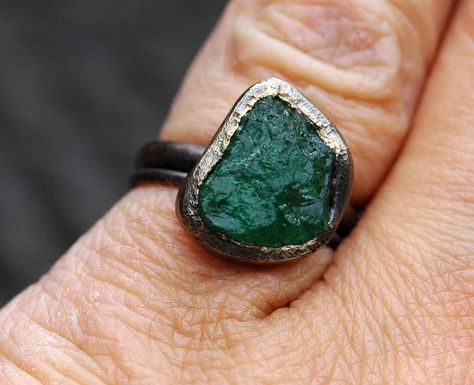 Here’s one of my gigantic raw emeralds set into my hand-fabricated oxidized 18k rose gold engagement and wedding ring set. Each of these ring sets is designed around a large, untreated raw emerald that I source specifically for the project. I have been setting uncut emeralds, diamonds, sapphires and rubies (as well as most of the semi-precious category of gemstones) into my work since 2008. Get in touch if your dream ring is centred around the raw and the rough. #rawemerald #roughemerald ... Gold Engagement And Wedding Ring, Engagement And Wedding Ring Set, Engagement And Wedding Ring, Raw Emerald, Wedding Ring Set, Rose Gold Engagement, Dream Ring, Gold Engagement, Wedding Ring Sets