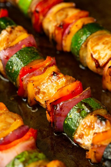 These delicious, Asian Grilled Chicken Veggie Skewers employ a secret shortcut. They're sweet, sticky and have a bit of heat. Make them for rave reviews! #asianchickenskewers, #easygrillrecipe, #chickenandvegetableskewers Chicken And Veggie Skewers, Grilled Entrees, Grilled Skewers, Quick Foods, Barbecued Chicken, Grilled Chicken Kabobs, Grilled Recipes, Fruit Kebabs, Grilled Foods