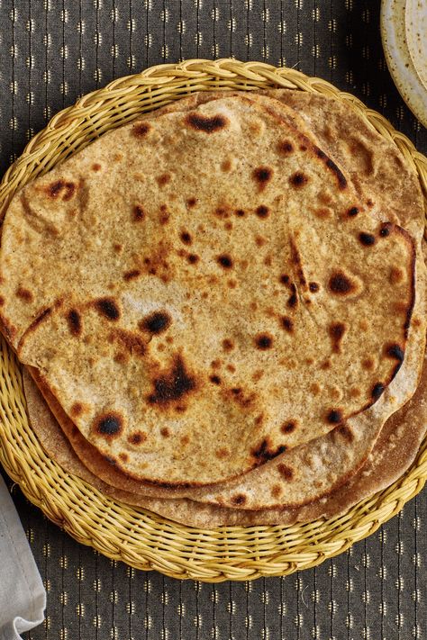 Need homemade bread in a hurry? This recipe for tender soft chapatis can be ready in just 90 minutes. Chapati, an everyday flatbread sometimes called roti, is a staple of north Indian cooking and you’ll find versions across the cuisines of Southeast Asia, East Africa, and the Caribbean. Like tortillas, they are incredibly versatile. Chapati Recipe, Chapati Recipes, Aloo Paratha, Bon Appetite Recipes, Griddle Cooking, Best Bread Recipe, Indian Bread, Pastry Flour, Naan Bread