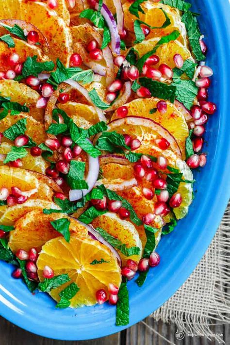 Mediterranean Orange and Pomegranate Salad Recipe | TMD Navel Orange Recipes, Festive Salad, Pomegranate Recipes Salad, Orange Pomegranate, Fish Entrees, Vegan Coleslaw, Honey Dressing, Pomegranate Salad, Navel Oranges