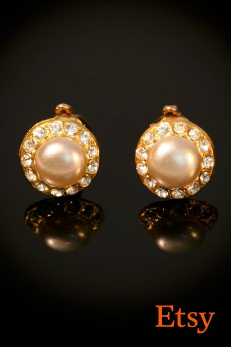 small round gold clip on earrings with a large imitation pearl in the center and rhinestones on the perimeter, surrounding the larger faux pearl 50s Earrings, Prep Girl, 60s Jewelry, Mid Century Earrings, Retro Festival, Vintage Gold Earrings, Classy Earrings, Retro Earrings, Vintage Clip Earrings