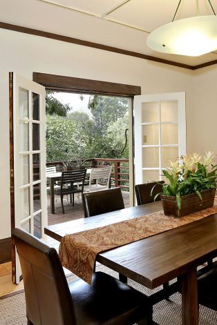 French doors and hardwood floors are features of the formal dining room. Photo: Liz Rusby Dining Room With French Doors To Patio, Dining Room With French Doors, Spanish Dining Room, Dining Room French Doors, Room Division, Room With French Doors, Dinig Room, Dining Room Glam, Door Decks