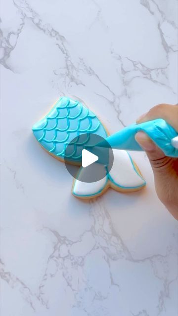 Julia Perugini on Instagram: "I can’t resist the sweetness of mermaid tail cookies!🧜‍♀️🍪✨ Can’t decide between a magical mermaid party or a unicorn extravaganza? Dive into the delicious dilemma with me!   #Mermaids #mermaidtail #mermaidlife #cookievideo #cookietutorial #mermaidcookies  .  Cookie cutter by @annclarkcookiecutters" Ariel Cookies Decorated, Mermaid Tail Cookies, Mermaid Cookie, Mermaid Cookies, Magical Mermaid, Cookie Videos, Cookie Tutorials, Mermaid Life, Mermaid Tails