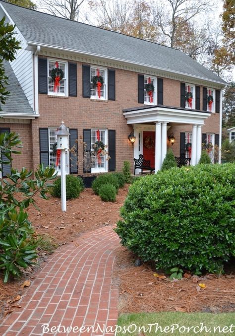 Hanging Wreaths on Exterior Windows, Brick Walkway Christmas Wreaths On Windows, Outdoor Holiday Wreaths, Wreaths On Windows, Christmas Wreaths For Windows, Hanging Wreaths, Outdoor Christmas Wreaths, Exterior Windows, Window Wreath, Brick Walkway