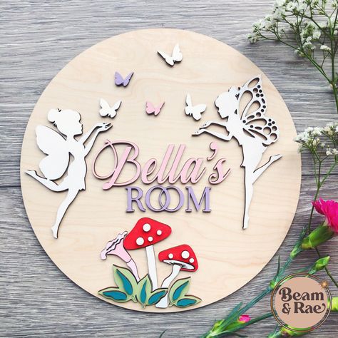 This pretty and contemporary fairy door sign is made from oak veneer and hand painted with custom mix paints. It can be fixed to the wall with command strips (included) or if you would prefer, it can be made into a hanging sign with the addition of two holes which I will attach a white leather strap to. Each one is lovingly made by me and everything I make is designed by myself also so you won't find another sign like this from another seller. The overall depth of these signs vary, but are a min Bedroom Door Signs Diy, Diy Kids Paint, Nursery Door Sign, Wooden Name Plaques, Kids Door Signs, Kids Door, Fairy Bedroom, Fairy Nursery, Bedroom Door Signs