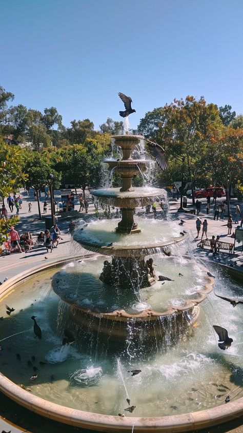 #Graceful Fountain Scene: A tranquil #fountain basks in the #sun, while #birds play in the #cascading #water amidst urban life. #city #aiart #aiphoto #stockcake ⬇️ Download and 📝 Prompt 👉 https://stockcake.com/i/graceful-fountain-scene_590312_1124255 Fountain City, Scene Image, Human Activity, Clear Blue Sky, Urban Life, Simple Beauty, Urban Landscape, Nature Beauty, Free Photos