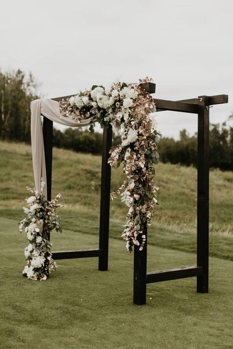 Garden roses, ranunculus, and other varieties of dahlia and tea roses were used to bring softness and contrast from the darker centres of the anemone. #wedding #weddingideas #weddingphotographer #weddingphotography #intimatewedding #weddinginspiration #weddingdetails #weddingflowers #flowers #elegantwedding #elegantweddingceremony #weddingceremony #blackweddingceremony #blackwedidngdecor #modernrusticweddingceremony #modernrusticweddingideas Black Wedding Arch, Black And Champagne Wedding, Black Ceremony, White Wedding Arch, Wedding Arches Outdoors, Wedding Arbors, Black And White Wedding Theme, Wedding Alters, Wedding Arch Rustic