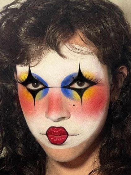 halloween clown makeup: colorful mix and match 80s Clown Makeup, Artistic Clown Makeup, Salina Killa Clown, Black White And Red Clown Makeup, 70s Clown Makeup, Beautiful Clown Makeup, Abstract Clown Makeup, Drag Inspo Makeup, White Face Clown Makeup