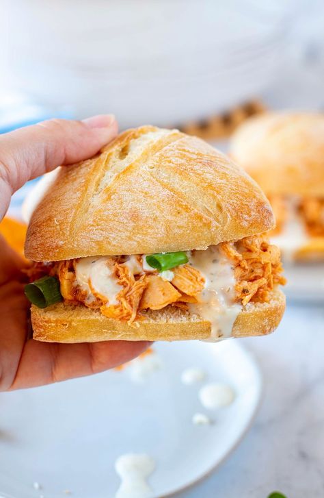 Shredded buffalo chicken always comes out super tender and has a nice kick to it from the spicy buffalo sauce. The best part is my buffalo chicken sandwiches are made in the Crock Pot for even easier cooking and cleanup. #Crockpot #Buffalo #easydinner Buffalo Style Shaved Chicken Recipes, Shredded Buffalo Chicken Sandwich, Buffalo Chicken Sandwich, Spicy Sandwich, Buffalo Chicken Pasta Salad, Shredded Buffalo Chicken, Chicken Sandwich Recipe, Buffalo Chicken Sandwiches, Homemade Buffalo Sauce