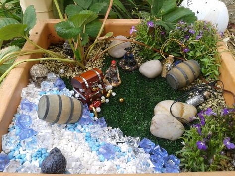 Pirate garden Pirate Fairy Garden Ideas, Pirate Garden, Fairy Garden For Boys, Steampunk Garden, Dino Garden, Mermaid Fairy Garden, Boy Fairy, Storybook Gardens, Dinosaur Garden