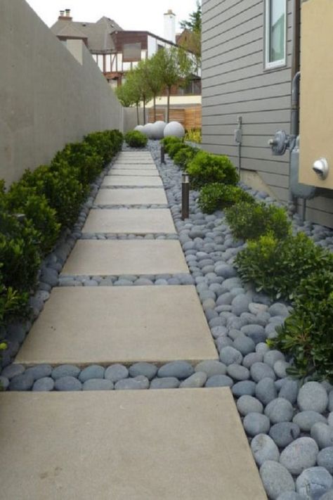 Make your house look aesthetic by placing river stones on the front walkway with concrete slabs. It prevents the walkway to get wet and requires low-maintenance. Modern Backyard Landscaping, Garden Walkway, Landscape Designs, Modern Backyard, Backyard Garden Design, Landscaping Tips, Diy Landscaping, Camping Ideas, Cool Landscapes