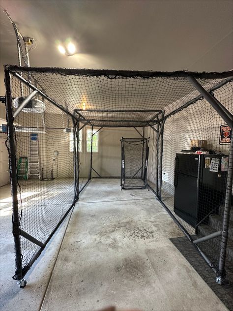 Check out Dino's build!

"The modular batting cage is done. I made it so that I can swivel it to the larger side of the garage and pull out the 2nd section. I also built a pitching screen protector for when I throw to my son. I used the 3/4 connectors, EMT conduit, and some pipe insulation with zip ties. I’m pretty happy with how it turned out. Check out the pics." Batting Cage In Basement, How To Build A Batting Cage, Batting Cages Indoor, Diy Indoor Batting Cage, Garage Baseball Training, Home Batting Cage Ideas, Basement Baseball Training, Basement Batting Cage, Indoor Batting Cage Garage