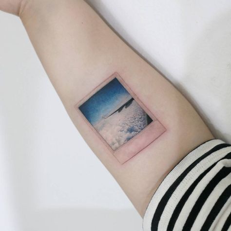 Polaroid film tattoo Polaroid Tattoo, Cross Stitch Tattoo, Circular Tattoo, Camera Tattoos, Airplane Tattoos, Stitch Tattoo, Framed Tattoo, Tatoo Inspiration, Circle Tattoos