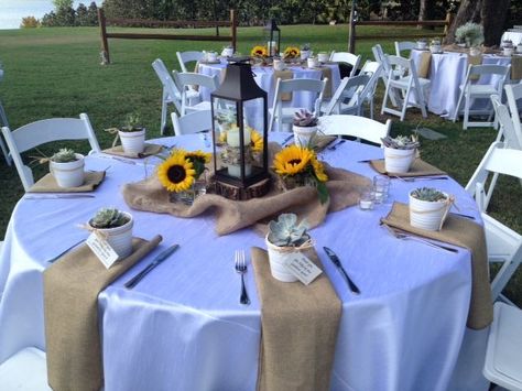 Lantern table scape with sunflower accents | Sunflower themed wedding, Rustic wedding table setting, Rustic wedding table Sunflower Themed Table Setting, Sunflower Table Centerpieces, Rustic Wedding Table Setting, Country Birthday Party, Navy Table, Sunflower Wedding Decorations, Homemade Wedding Favors, Sunflower Centerpieces, Sunflower Theme