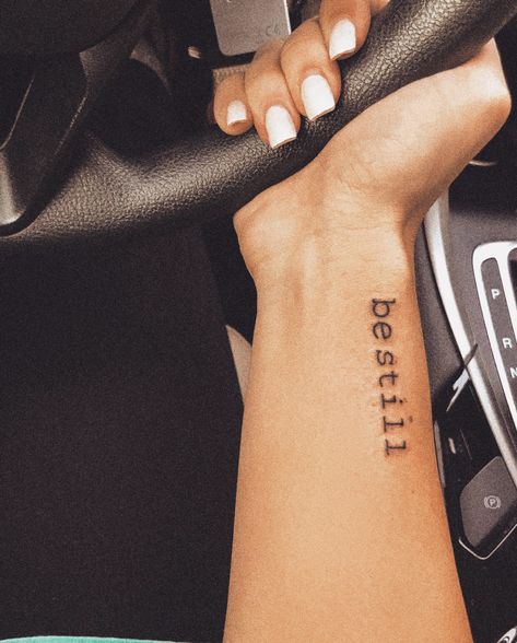 Be Still Tattoo Font Simple, Be Still Tattoo Wrist, Forearm Tattoo Women Small Quotes, Strength Wrist Tattoos For Women, Word Wrist Tattoos, Tattoo Be Still, Peace Be Still Tattoo, Inside Wrist Tattoo, Inside Wrist Tattoos For Women