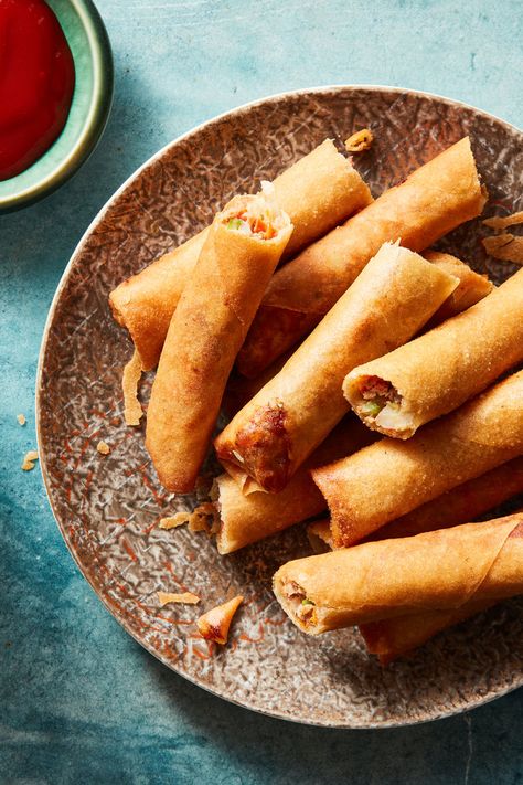 Lumpia Shanghai Recipe - NYT Cooking Lumpia Shanghai Recipe, Lumpia Shanghai, Shanghai Food, Banana Ketchup, Fried Spring Rolls, Light Meals, Overripe Bananas, Nyt Cooking, Hot Oil