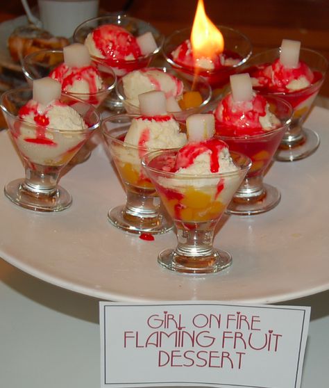 "Girl on fire" Flaming Desserts for a Hunger Games Dinner Party #hungergamesparty #hungergames Flaming Desserts, Fire Desserts, Phoenix Party, Hunger Games Theme, The Hunger Games Movie, Hunger Games Tributes, Book Club Food, Hunger Games Movie, Disney Movie Night Dinner