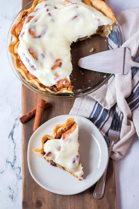 Cinnamon roll pie is an amazing breakfast or dessert treat with warm and gooey cinnamon rolls baked inside a flakey pie crust and covered is a sweet cream cheese frosting! Made with homemade from scratch cinnamon rolls this is a crowd pleasing dessert that everyone will love. Scratch Cinnamon Rolls, Cinnamon Roll Pie, Cracker Barrel Copycat, Cracker Barrel Copycat Recipes, Flakey Pie Crust, Premade Pie Crust, Gooey Cinnamon Rolls, Cinnamon Roll Bake, Store Bought Frosting