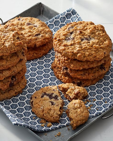 Giant Cowboy Cookies | Some claim cowboy cookies hail from Texas, a state many cowboys call home. Others say the treats were named for their ability to withstand long days in a saddlebag. Whatever its origin, the combination of oats, chocolate, pecans, and coconut is undeniably delicious.  #food #recipe #marthastewart #desserts #cookies Cowboy Cookie Recipe, Pbs Food, Pecan Rolls, Cowboy Cookies, Cacao Chocolate, Oatmeal Cookies, Cookie Bars, Treat Recipe, Martha Stewart