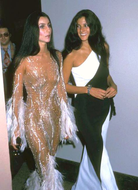 Cher and friend, Paulette Betts, attend The Met Gala, 1974. Click on image for full view. Cher 1970s, 1970s Photos, Met Gala Red Carpet, Sheer Gown, The Met Gala, Costume Institute, Red Carpet Dresses, Celebrity Look, Doja Cat