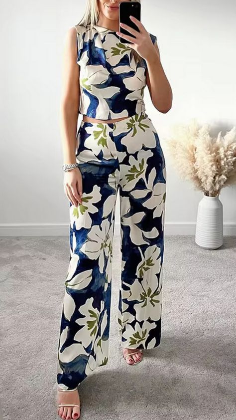 I saw this stunning Blue Floral O-Neck Sleeveless Hollow Out Zipper Female Bohemian Wide Leg Loose Jumpsuit, and I couldn't help but dream about all the places I could wear it!   The flowy design and beautiful floral print make it perfect for summer outings or beach vacations.   What do you think? Would you rock this jumpsuit? Let me know in the comments! 💙🌸✨   #FashionDreams #BohoChic #JumpsuitLove #SummerStyle #OOTD Blue Floral Jumpsuit, Olivia Pope, Loose Jumpsuit, Flowy Design, Beach Vacations, Floral Jumpsuit, You Rock, Girls Fashion, Fashion Essentials