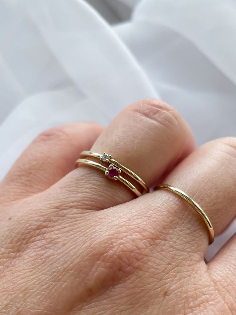 ✨ Dainty, elegant, and oh-so-lovely! This dainty ruby and diamond ring is one of our newest arrivals - just in time for Ruby Month. Who else loves the combination of rubies and diamonds? _ #Ruby #JulyBirthstone #Birthstone #Style #Fashion #ForYou #GoldRing #StackableRing #Wolfville Luxury Ruby Rings In Dainty Style, Luxury Minimalist Ruby Rings, Dainty Oval Ruby Jewelry, Minimalist Red Ruby Ring, Timeless Red Ruby Ring In 14k Gold, July Birthstone, Ruby Diamond, Stackable Rings, Ruby