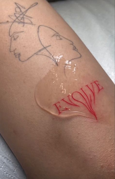 the word « evolve » in red tattoo anchor Dripping Word Tattoo, Evolve Tattoo Words, Red Art Tattoo, Cool Red Tattoos, Red Tattoo Faded, Red Swirl Tattoo, Dripping Tattoo Ideas, Evolve Tattoo Ideas, Small Pink Tattoo