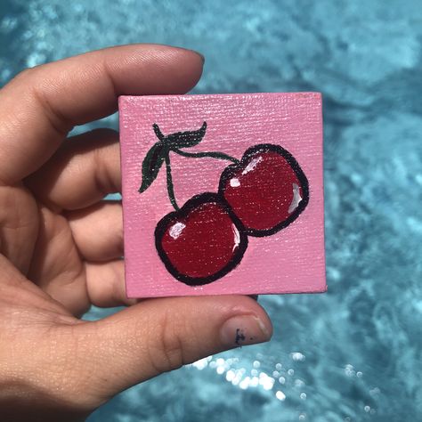 2”x2” mini canvas painting of the cutest cherries 🍒 this mini canvas comes included with the purchase of the original Cherry Bomb canvas painting. #minicanvas #minicanvasideas #minicanvaspainting #minicanvasart #acrylicpainting #acrylicart #dormartwork #dormdecor #bedroomart #bedroomdecor #bedroomwallart Cute Mini Art Easy, Mini Canvas Art 2x2, 2x2 Canvas Paintings Easy, 4x4 Canvas Ideas Easy, Tiny Paintings Simple Easy, Tiny Canvas Art Easy, Cherry Painting Aesthetic, Cherry Painting Easy, Cherry Canvas Painting