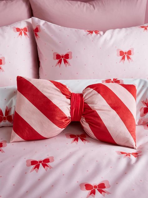 Sassy B Dotty Bows 3D Cushion- PinkThis 3D Bow Cushion from Sassy B is a fab way to tie your sleep space style together. Whether you’re using the bow-shaped design to create a playful feel or bringing bold beauty with its candy-striped red and white palette, you’ll have no trouble finding a way to use it to its full effect.Soft and comfortable, it comes complete with a filler so you can see how it looks straight away.Depth: 5 CMDesign Type: PatternedHeight: 230 CMMaterial Content: 100% PolyesterWashing Instructions: Machine WashableWidth: 220 CMHella Sassy Homeware. We know life isn?t perfect but your bedroom can be. Always remember to stay sassy!Soft and Comfortable: Feeling gentle on the skin for a relaxed space.Reminder: Do not place on lighter coloured furnishings.Warning: This product Bow Cushion, Lilac Bedding, Xmas Inspiration, Orla Kiely Bedding, Bow Inspiration, Candy Pillows, Katie Piper, Blocks Preschool, Bow Pillows