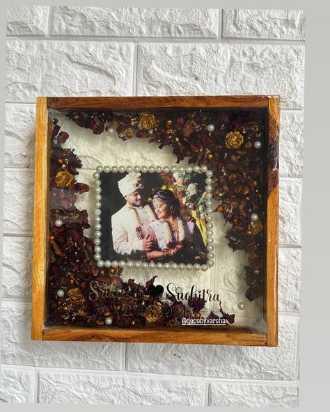 Wedding garland preserved ❤️🧿 Resin photo frame in a teak wood frame ♾️ Size 10inch Resin photo frame, resin garland preserved, handcrafted resin art, resin art, Bangalore resin art, resin artists Wooden Frame Resin Art, Garland Preservation Resin, Resin Photo Frame, Resin And Wood Diy, Resin Photo, Anniversary Frame, Wedding Garland, Ganesh Art, Hanging Frames