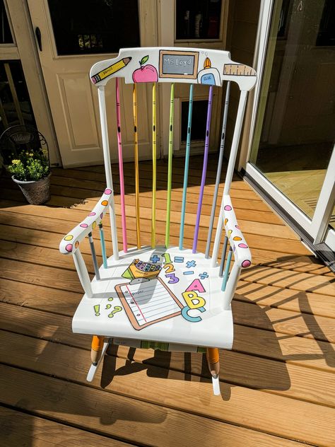 This is a MADE TO ORDER chair that is painted to incorporate a fun and whimsical classroom theme. I reclaim and repaint a standard boring chair and turn it into an exciting classroom or homeschool accessory! Whether for a special treat for your students, a unique chair for your favorite teacher, or some other classroom decor, this chair is sure to WOW.  Parents, students, teachers, and administrators alike will be drawn to this chair and its uniqueness. *Unfortunately, I cannot ship these chairs (it's far too expensive and cumbersome You must be able to arrange a pickup in Raleigh NC. Please read carefully, otherwise your order may be cancelled! Included in this listing are pictures of some the chairs I have recently completed. I will be able to incorporate a few different variations/eleme Teacher Rocking Chair Painted Diy, Painted Rocking Chairs For Classroom, Teacher Chairs For Classroom, Teacher Rocking Chair Painted, Classroom Rocking Chair, Teacher Rocking Chair, Whimsical Classroom, Teacher Rocking Chairs, Teacher Stool