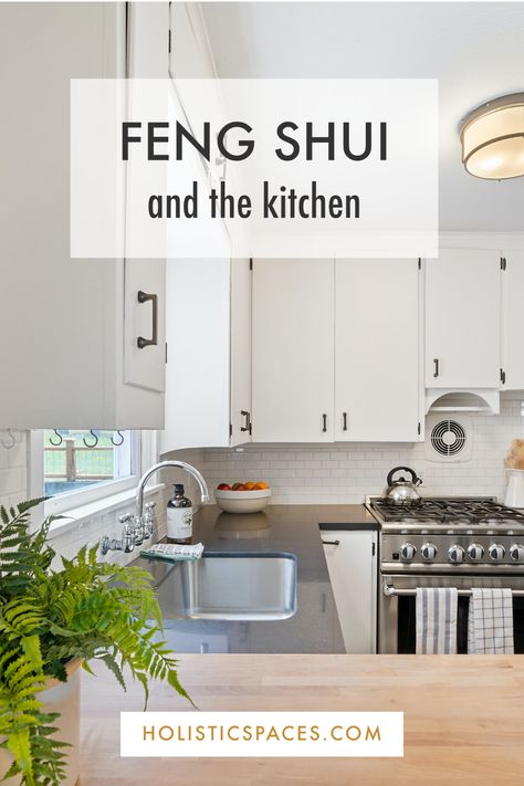 Photo of white kitchen with stainless steel oven and green plant on the counter. Text: "Feng shui and the kitchen. Holisticspaces.com" Kitchen Feng Shui Layout, Feng Shui Kitchen Layout, Feng Shui Layout, Corner Kitchen Table, Decorating Above Kitchen Cabinets Ideas, Kitchen Layout Ideas With Island, Feng Shui Kitchen, Grey Blue Kitchen, Decorating Above Kitchen Cabinets