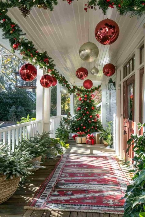 40 Christmas Front Porch Decor Ideas for a Festive Welcome Country Porch Christmas Decor, Decorate Front Of House For Christmas, Porch Christmas Ornaments, Red Outdoor Christmas Decor, Red Brick House Christmas Decor Outside, Country Christmas Front Porch Decor, How To Decorate Your Front Porch For Christmas, Large Front Porch Christmas Decor, Christmas Tree On Front Porch Ideas