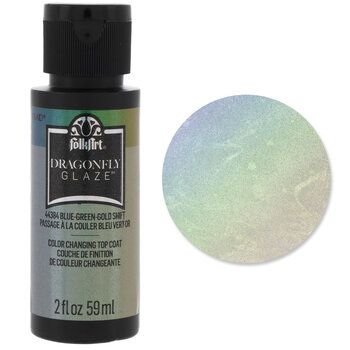 Color your projects with a show-stopping sheen! FolkArt Dragonfly Glaze Top Coat is a premium, color-shifting top coat that provides an iridescent finish. It is water-based, non-toxic, and cleans while wet with soap and water. Use the multi-surface formula indoors or outdoors on wood, terra cotta, metal, and more. Apply this top coat over light and dark base colors to create a multi-color shifting effect! Details: 	 Medium: Acrylic 	 Finish: Iridescent 	 Color: Blue-Green-Gold Shift 	 Color Code Unicorn Spit, Iridescent Color, Glaze Paint, Blue Green Gold, Faux Painting, Light And Dark, Paint Colors For Home, Stencil Painting, Terra Cotta