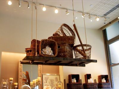 Hang a ladder and store stuff on top. Retail Display=Home Decor Inspiration. Basket Display Ideas Retail, Hanging Basket Display, Ceiling Display, Gift Shop Displays, Basket Display, Hanging Ladder, Retail Inspiration, Market Displays, Dropped Ceiling