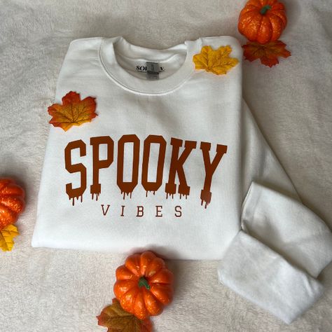 Spooky Vibes Crewneck with Texas Orange lettering SIZING : The crewnecks are unisex, which means they do run a bit larger. Please look at our size chart to guarantee you are getting the correct fit for you! CARE : To ensure the longevity of your crewneck, wash with cold water and dry inside-out or hang dry. Halloween Crew Neck Sweatshirt, Fall Cricut Shirts, Halloween Horror Nights Outfit, Spooky Crewneck, Fall Shirt Ideas, Halloween Tshirt Ideas, Fall Shirts Vinyl, Cricut Clothing, Fall Crewneck