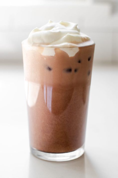 A glass of homemade Starbucks iced mocha latte on a white countertop. Mocha Iced Coffee Recipe, Copycat Starbucks Mocha, Mocha Iced Coffee, Mocha Latte Recipe, Homemade Mocha, Homemade Starbucks, Starbucks Mocha, Mini Ice Cube Tray, Peace Coffee