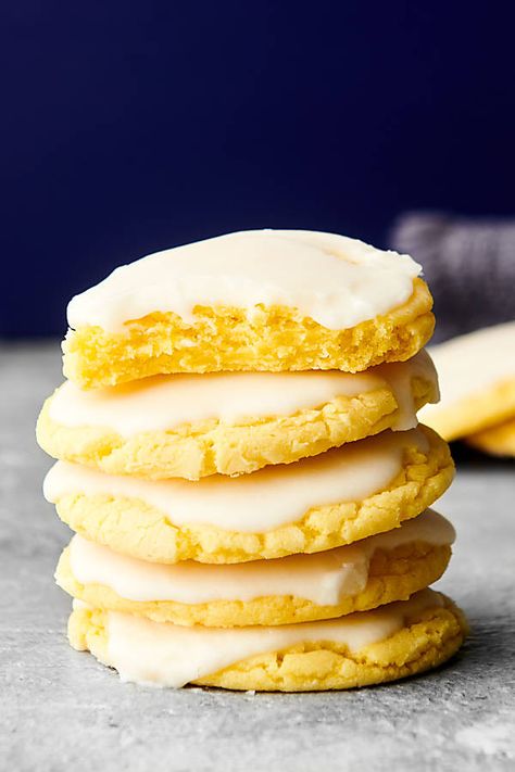 These Lemon Cookies are perfect for lemon lovers! These fluffy cookies are made with lemon cake mix, lemon pudding mix, and topped with a tangy lemon glaze. Bojangles Bo Rounds Recipe, Lemon Crinkle Cookies Recipe, Xmas Cake Recipes, Lemon Cake Cookies, Fluffy Cookies, Lemon Cake Mix Recipe, Pudding Cookies Recipes, Lemon Cake Mix Cookies, Gluten Free Vanilla Cake