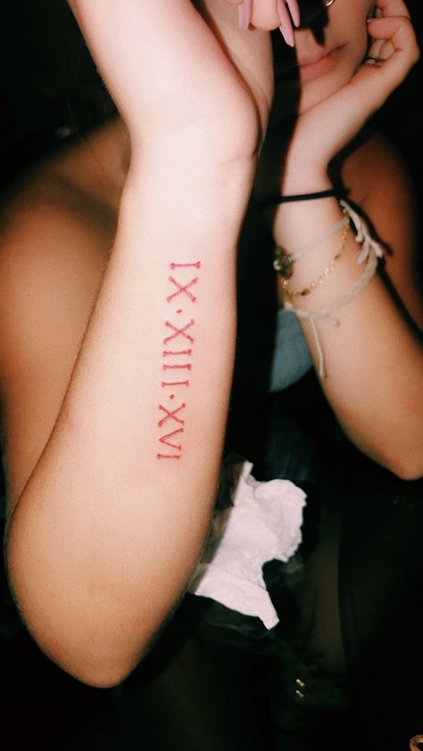 Red Roman Numeral Tattoo Arm, Red Tattoo Roman Numerals, Roman Numeral Fonts Tattoo, Roman Numeral Tattoo Red Ink, Red Ink Arm Tattoos, Red Roman Numeral Tattoo, Red Arm Tattoos For Women, Numeral Number Tattoo, Red Arm Tattoo