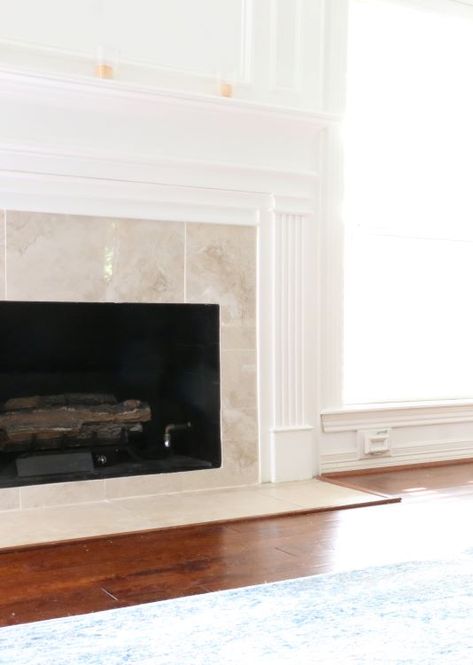 How to tile over an existing fireplace surround - My Woodlands Life Traditional Fireplace Tile Ideas, Changing Tile Around Fireplace, Plaster Over Tile Fireplace, Tile Fireplace Hearth, Tile Surround Fireplace, Mantle Update, Paint Fireplace Tile, Tile Around Fireplace, Marble Hearth