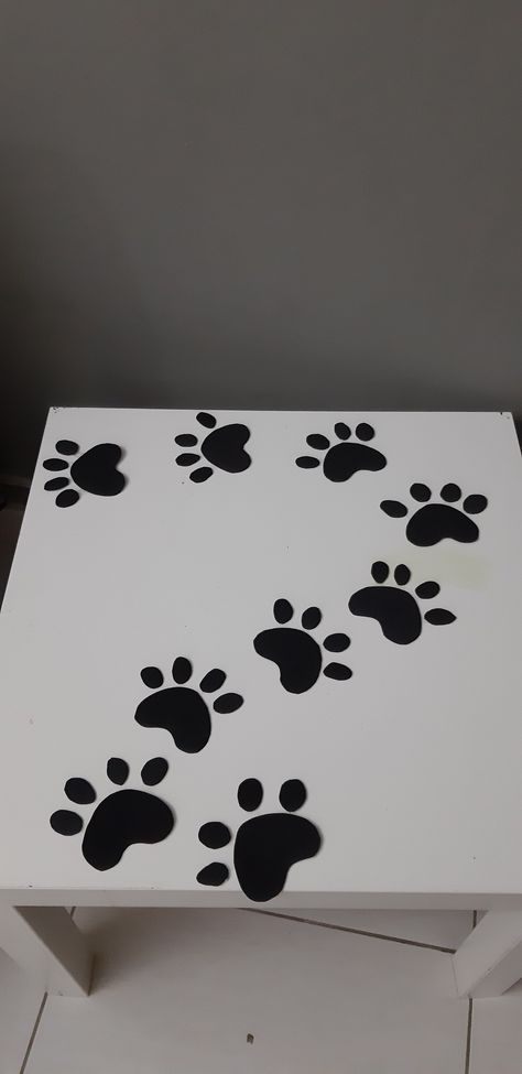 Table decor for a cat themed birthday party.Made with foami sheet. Cat Themed Decorations, Space Cat Birthday Party, Cat Themed Party Decorations, Black Cat Birthday Party, Cats Decoration Party, Cat Party Table Decorations, Cat Theme Party Games, Cat And Dog Themed Classroom, Cat Lady Birthday